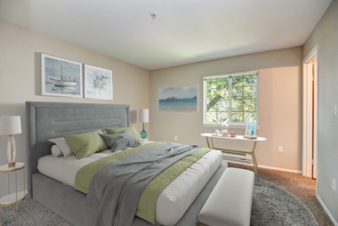 One Bedroom Apartments in Lacey WA - The Village at Union Mills - Bedroom with Plush Carpeting and Large Window