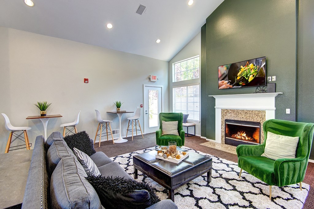 a living room with a fireplace and a flat screen tv
