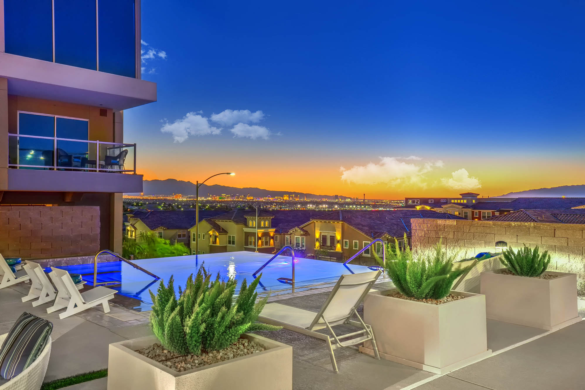 modern style pool with cabanas and daybeds