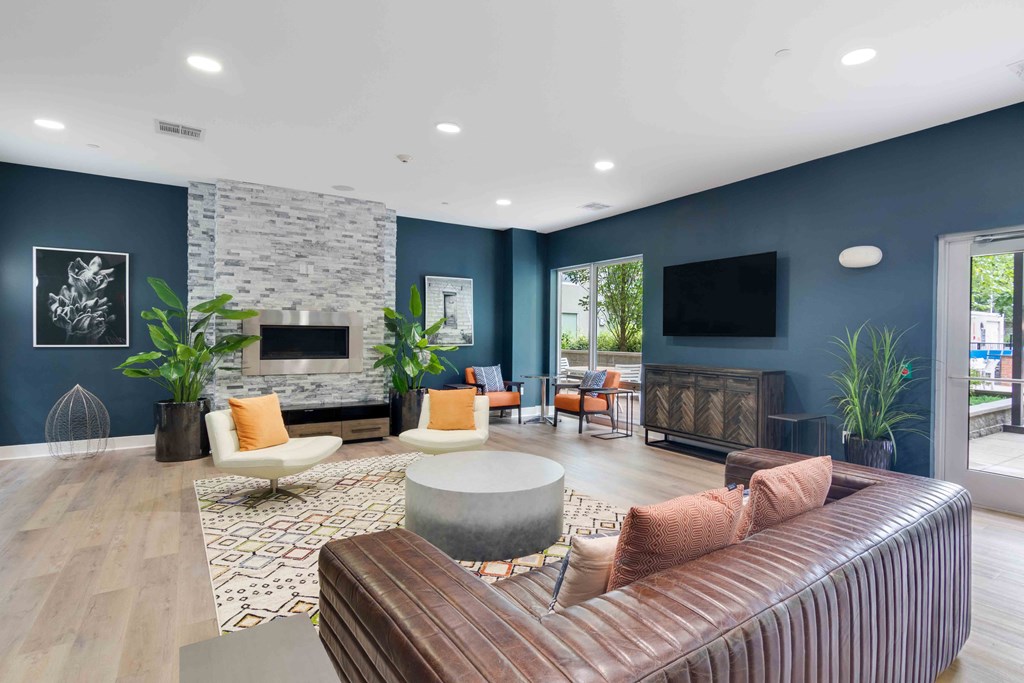 resident lounge with modern furnishings and fireplace