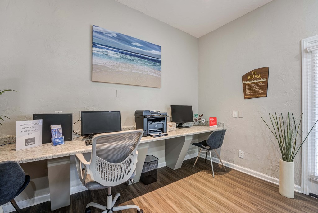 Apartments in Carlsbad, CA - The Village - Business Center with Computers, Printer, Office Chairs, and House Plants.