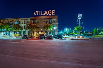 Photo of outside of Village of Rowletts building showing Village sign lit up. - Photo Gallery 24
