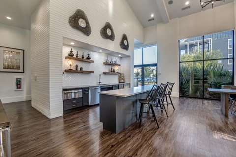the preserve at ballantyne commons modern kitchen with stainless steel counter top and island