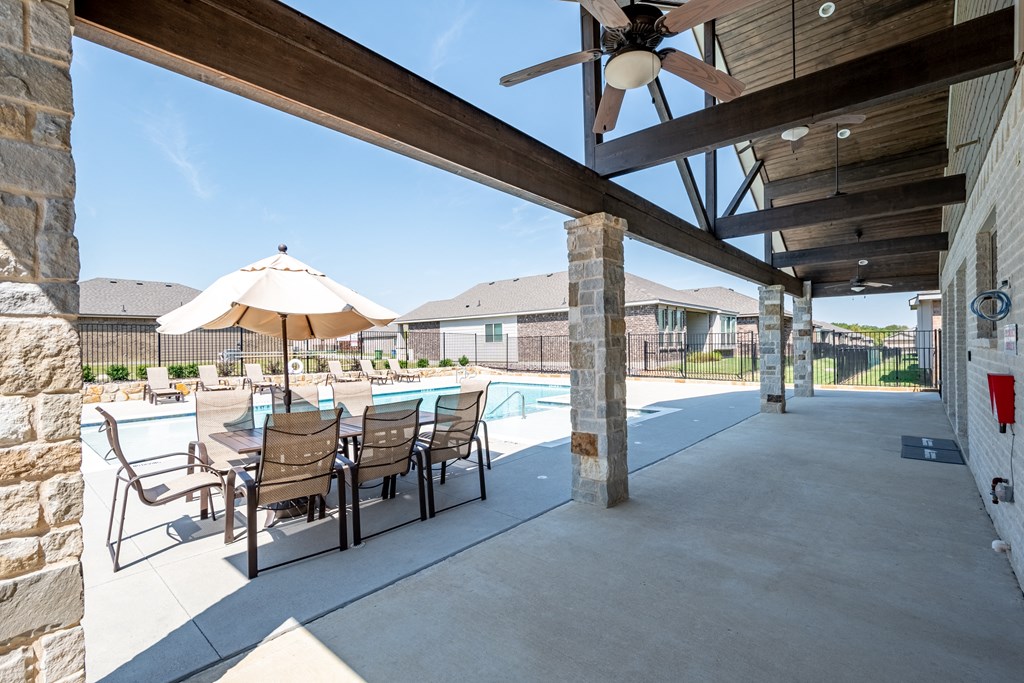 our 2400 2400 2400 patio has a table and chairs and a pool