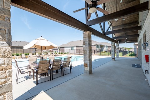 our 2400 2400 2400 patio has a table and chairs and a pool