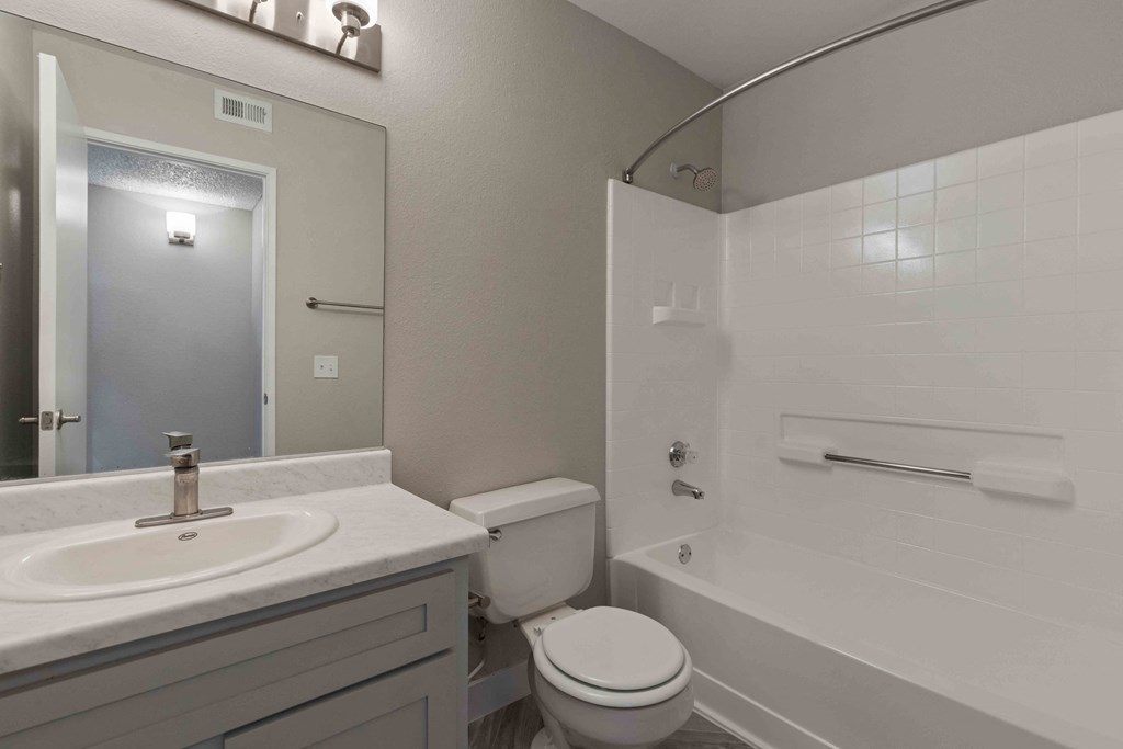 a bathroom with a sink toilet and a tub