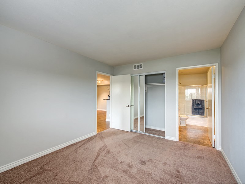 bedroom with adjacent bathroom