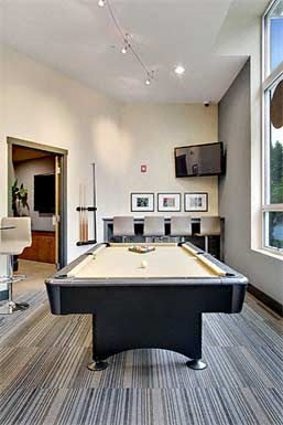 compass apartments community center pool table in clubhouse
