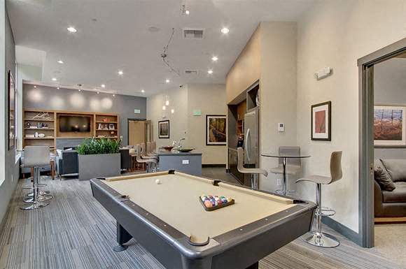 a living room with a pool table