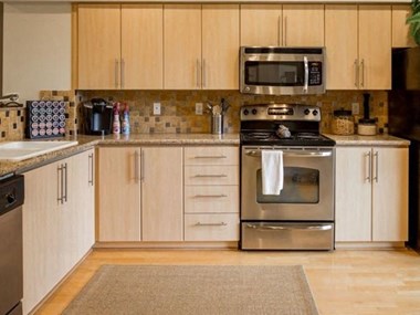 Slab Granite Countertops with Tile Backsplash