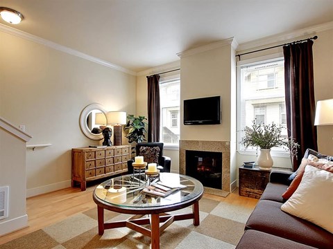 a living room with a couch and a table