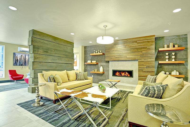 a living room with a couch and a fireplace