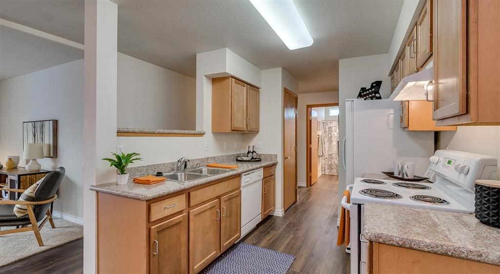 Apartments Spokane WA - Canyon Bluffs - Fully Equipped Kitchen with Granite Countertops and White Appliances