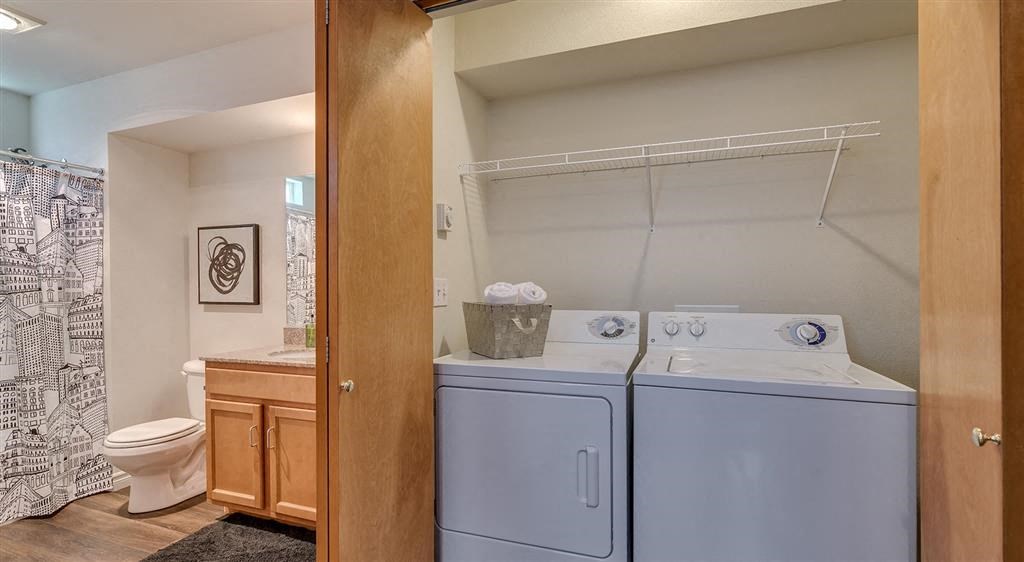 Spokane Apartments - Canyon Bluffs - Washer-and-Dryer in a Closet with Storage Space Next to Bathroom