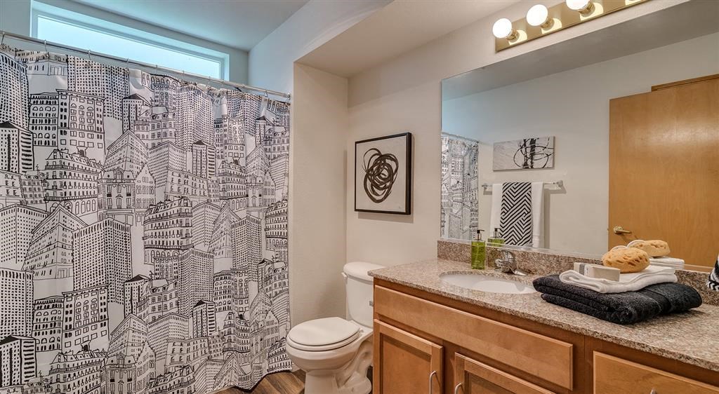 bathroom with wood-style flooring