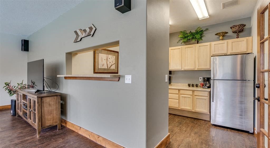 One Bedroom Apartments in Spokane, WA - Deer Creek - Entrance to Kitchen from Living Room with Wood-Style Flooring