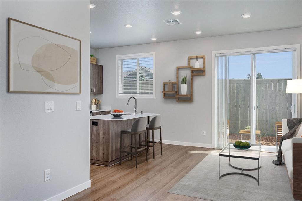 Pet Friendly Townhomes in Vancouver WA - Ridgeline View - Spacious Living Room with Vinyl Plank Flooring, 9FT Ceilings, and Access to the Patio