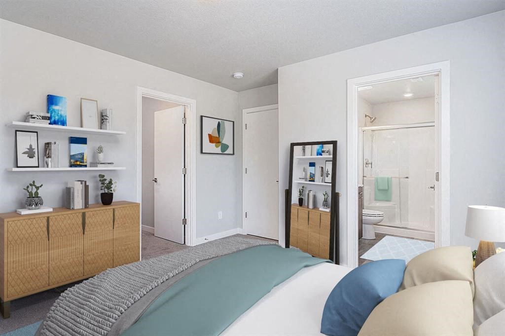 a bedroom with a bed and a bathroom