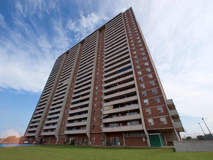 a tall building with a blue sky in the background