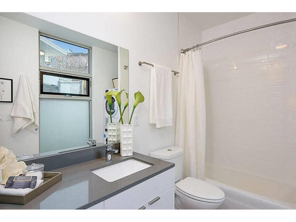 Bathroom with grey countertops