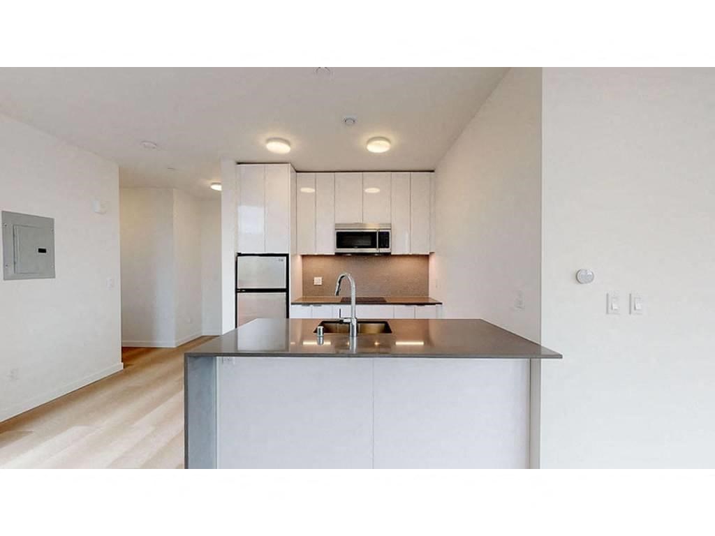 Kitchen with grey countertops