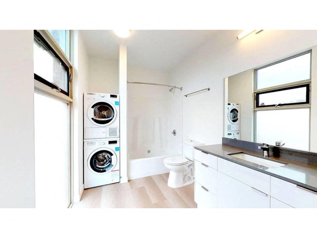 Bathroom with washer and dryer