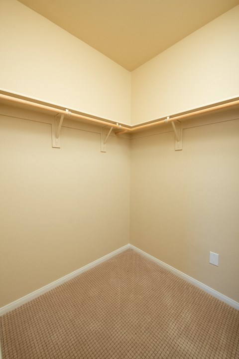 a empty room with two hanging lights on the wall