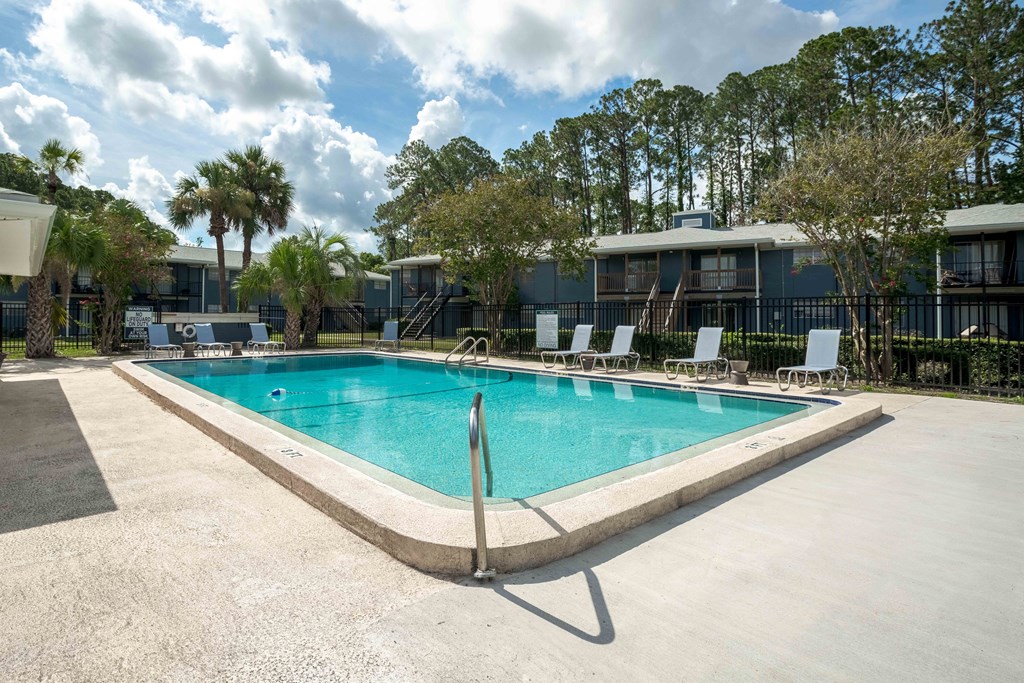 Poolside view showing water, deck space, and community amenities at The Marley at Trout River in Jacksonville, Florida.