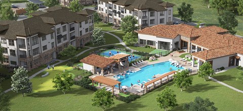 A resort with a swimming pool and a building with a red tile roof.