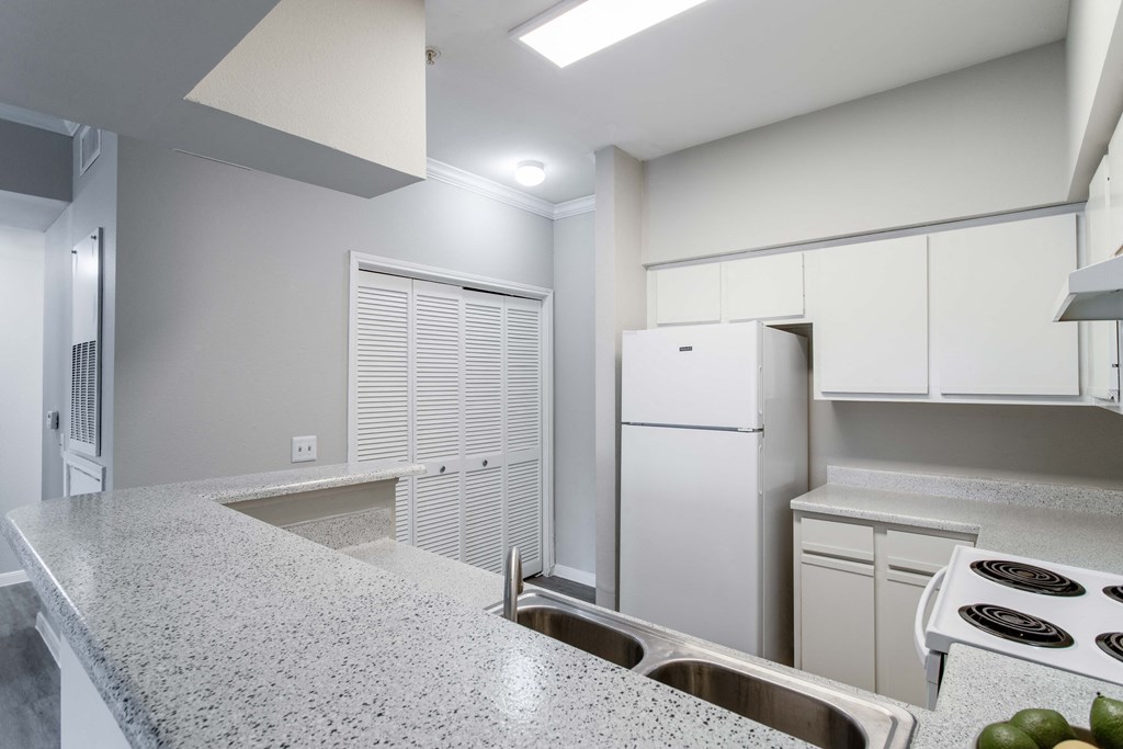 Affordable Houston Texas Apartments – Westchase Forest – Photo of kitchen with white cabinets