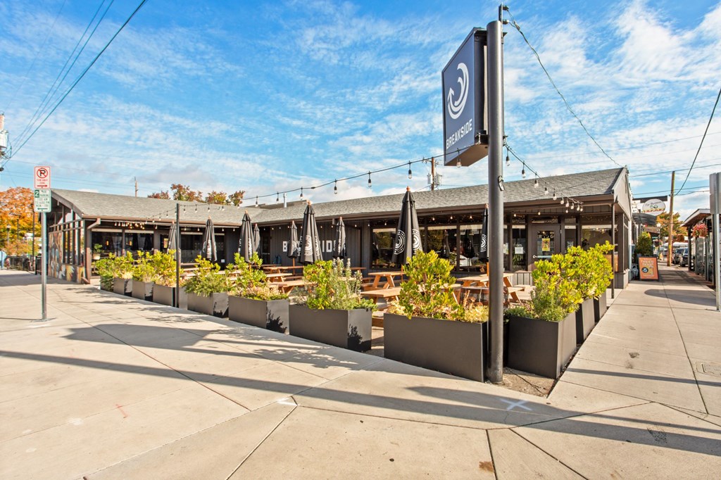A street view of a building with a sign that reads "BREWERIES".