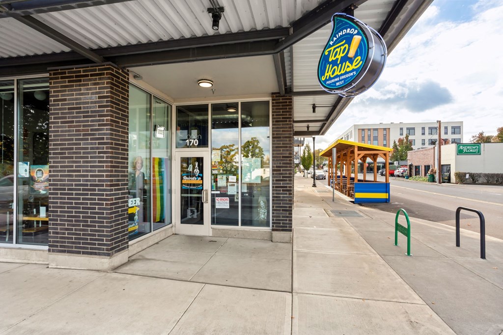 A Step House storefront with a blue sign above the entrance.