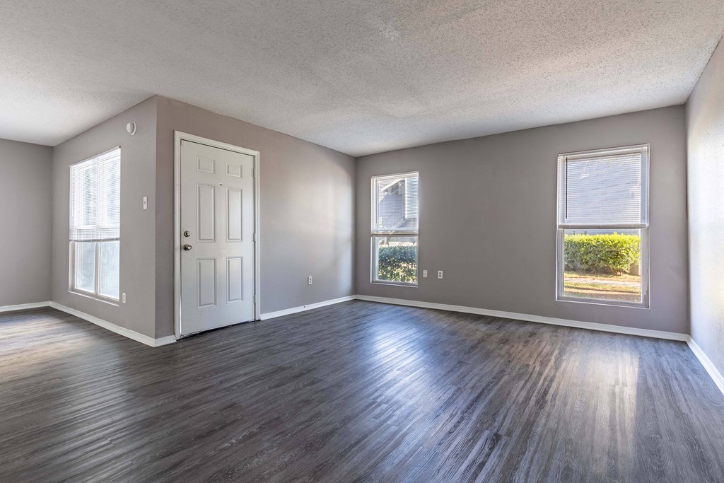 Whitney Manor Apartments in Gretna, LA photo of living room with hardwood floors