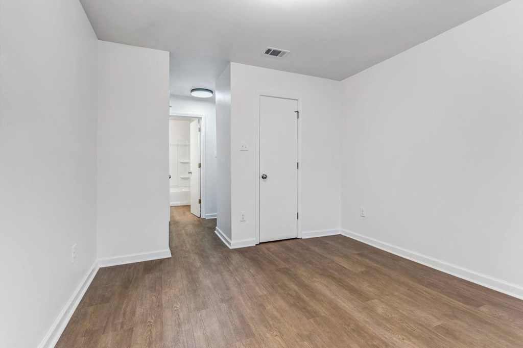 Whitney Manor Apartments in Gretna, LA photo of  bedroom with hardwood flooring