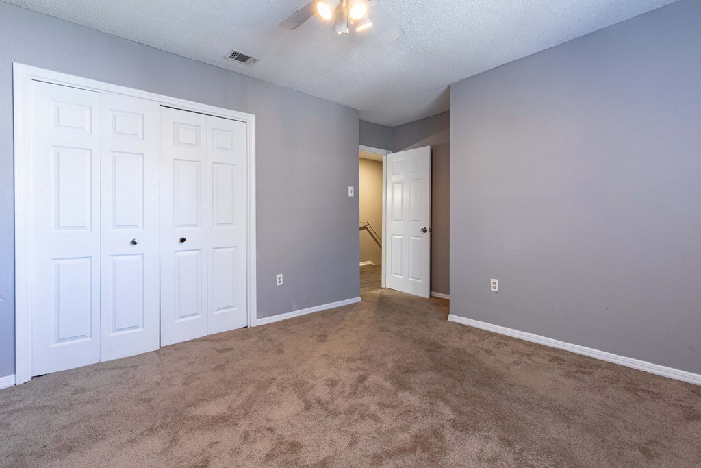 Whitney Manor Apartments in Gretna, LA photo of bedroom with plush carpeting