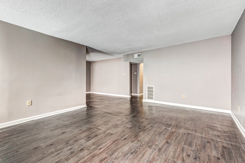 Whitney Manor Apartments in Gretna, LA photo of living room with hardwood flooring