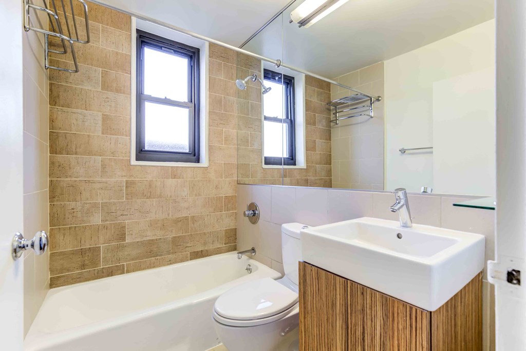 a bathroom with a sink toilet and a bath tub