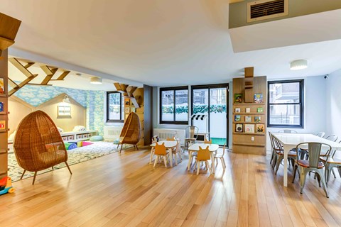 a living room and dining room with a table and chairs