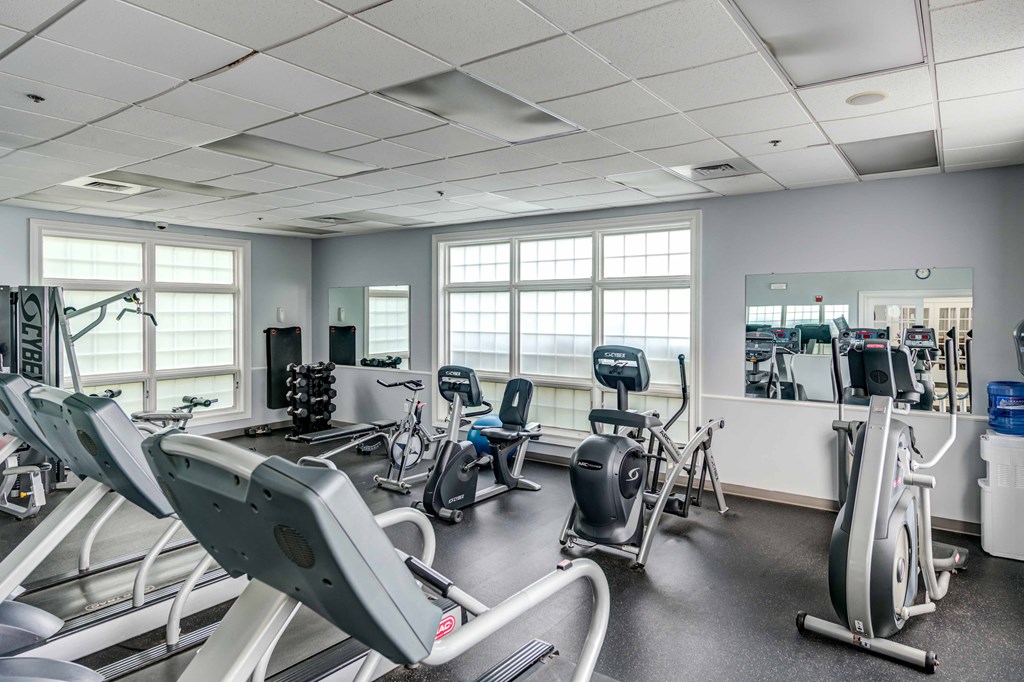 fitness center with cardio and weight equipment