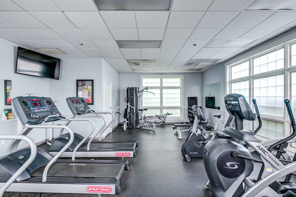 fitness center with cardio and strength training equipment