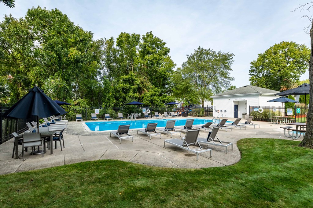 pool area with sun deck and lounge chairs