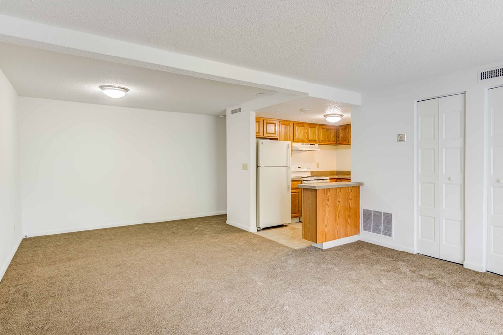 living room and kitchen with white appliances