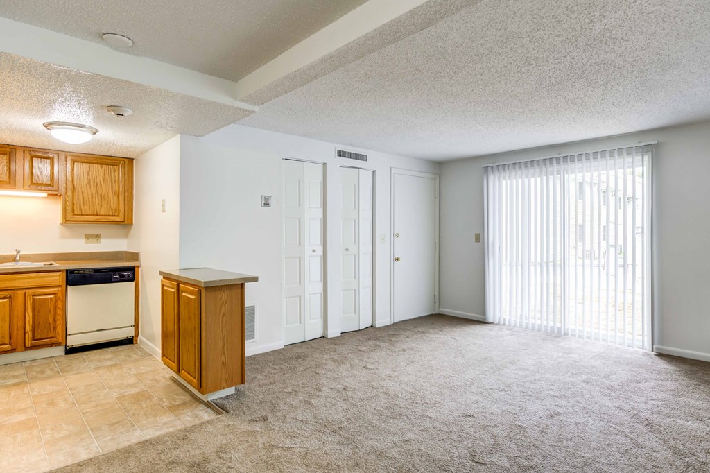 living room and kitchen with white appliances