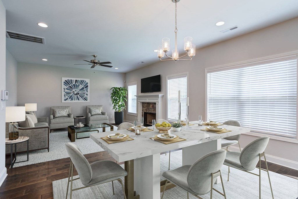 a dining room with a table and chairs