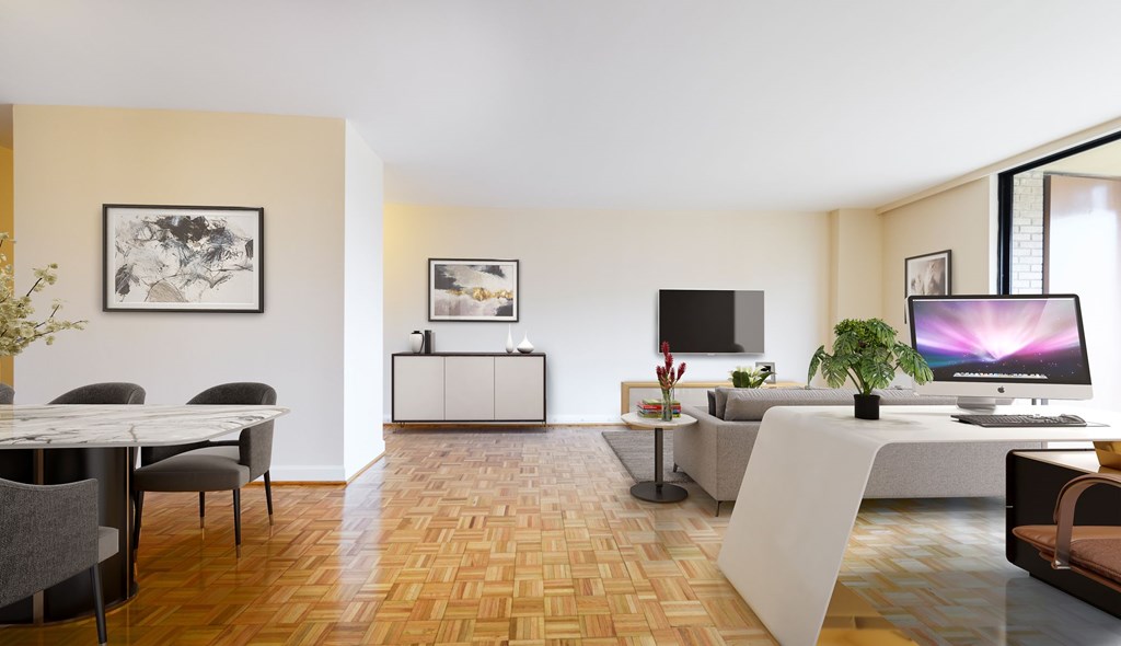 A modern living room with a wooden floor and a large window.