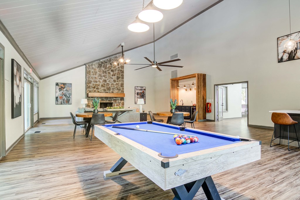 Resident clubhouse with pool table at Wyndcliff Galleria apartment community in Smyrna GA