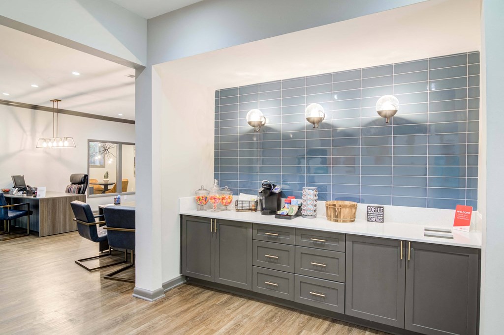 Coffee area inside the leasing office at Wyndcliff Galleria in Smyrna, GA, featuring a coffee machine and countertop space.