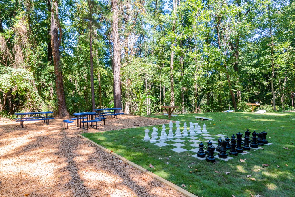 Outdoor recreational area with lawn games on a green open space at Wyndcliff Galleria in Smyrna, GA.