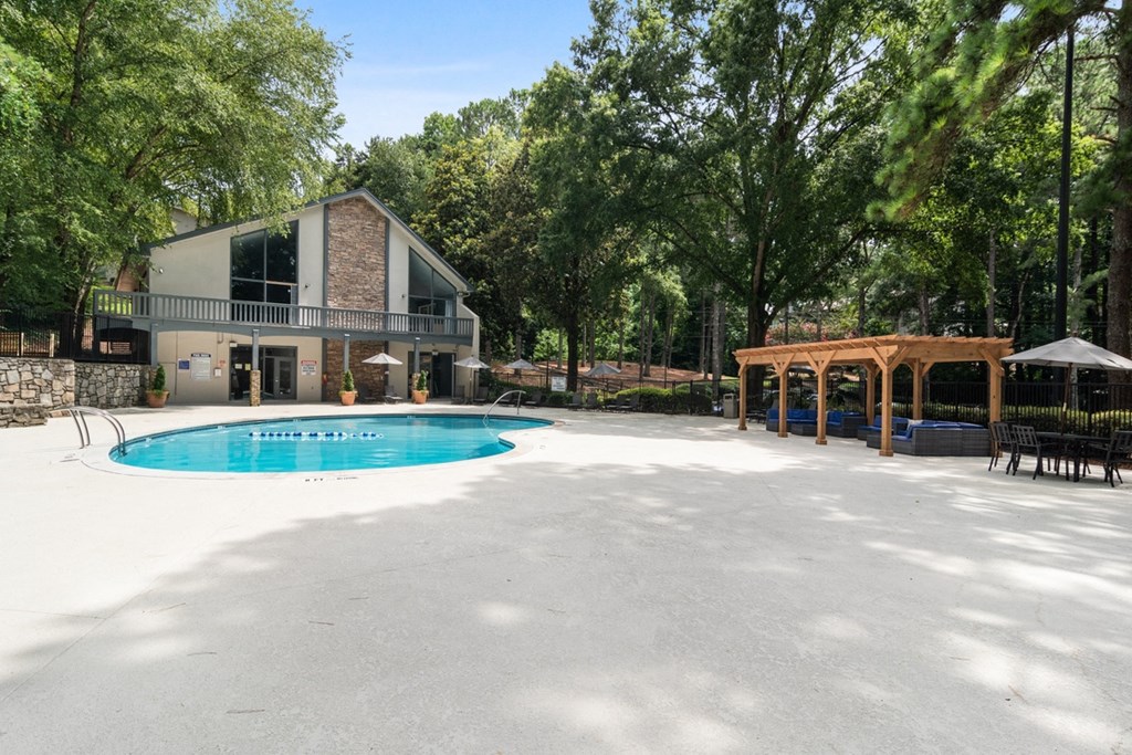 Spacious resort-style pool surrounded by lounge seating at Wyndcliff Galleria in Smyrna, GA.