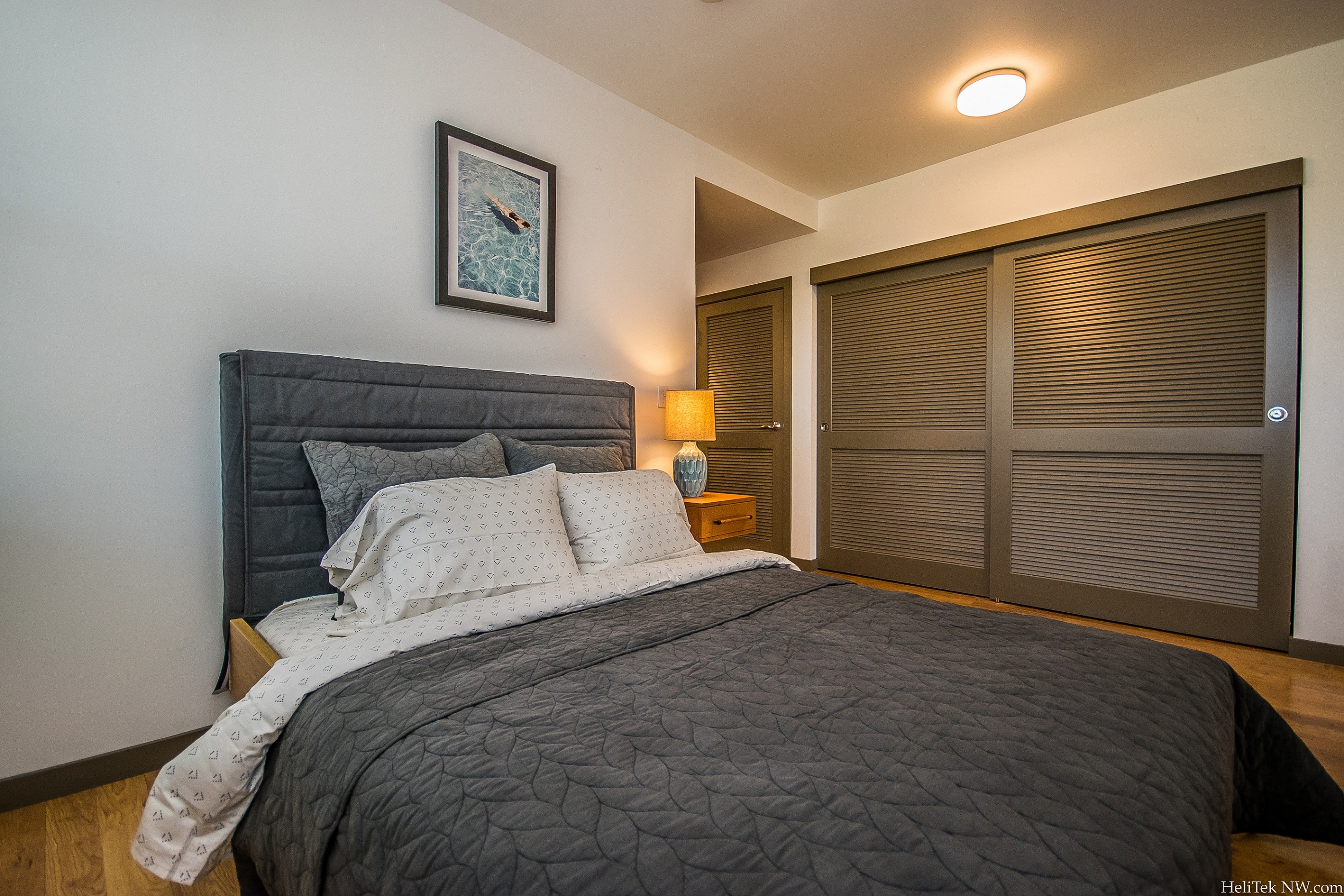 Pet-Friendly Apartments in SW Portland, OR - Corbett Heights - Furnished Bedroom with Closet and Hardwood Floors